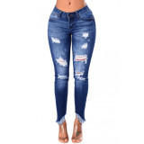 Nine point slim hip hole low rise fringed women's jeans