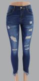 Nine point slim hip hole low rise fringed women's jeans