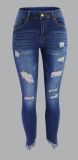 Nine point slim hip hole low rise fringed women's jeans