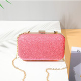 Shiny powder frosted casual dinner bag in hand