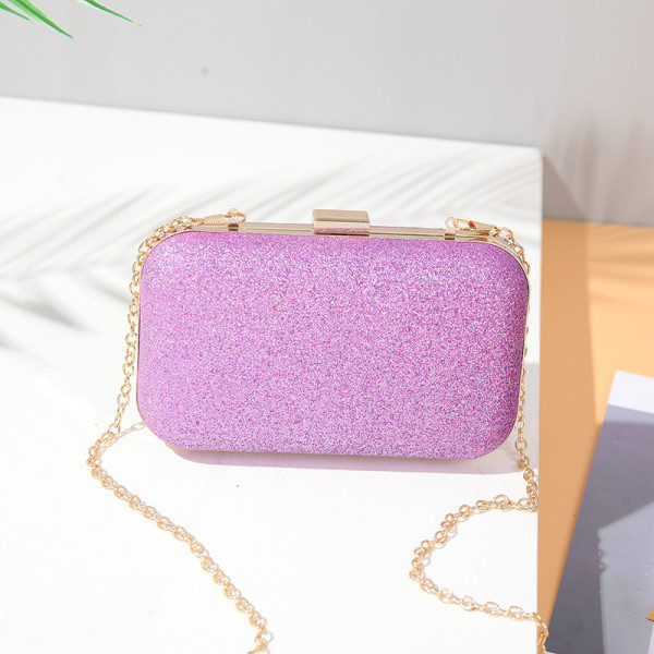 Shiny powder frosted casual dinner bag in hand