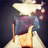 Women hold a dinner bag with color changing satin tassel dinner bag