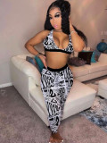 Printed suspender with exposed navel top, tight-fitting high-waisted trousers, sports casual suit
