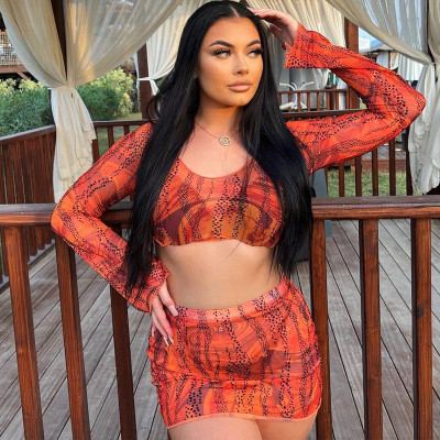Fashion print sexy open navel round neck long sleeve top skirt suit