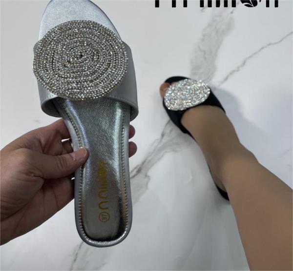 Flat sandals with rhinestone slippers on the outside
