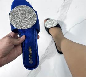 Flat sandals with rhinestone slippers on the outside