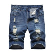 Perforated men's denim pants with many tattered jeans Perforated men's denim pants with many tattered jeans