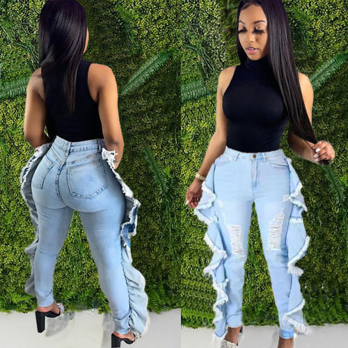 Perforated lotus leaf tassel elastic denim leggings