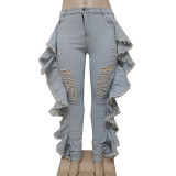 Perforated lotus leaf tassel elastic denim leggings