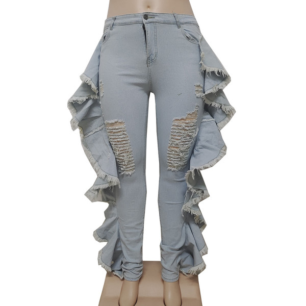 Perforated lotus leaf tassel elastic denim leggings