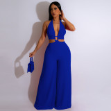 Solid color strapping neck wrap chest button wide leg jumpsuit
