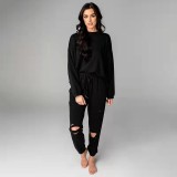 Solid color perforated round neck pullover pants for women