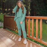 Solid color perforated round neck pullover pants for women