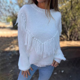 Loose fitting long sleeved fringed knit top