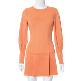 Long sleeved dress with open back mini skirt