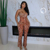 Low cut suspender with open back and high waisted jumpsuit
