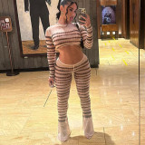 Striped navel exposed long sleeved top slim fitting long flared pants set