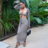 Long sleeved cardigan wrapped chest small vest half skirt three piece set