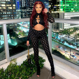 Perforated and hollowed out tight fitting round loop jumpsuit with exposed navel
