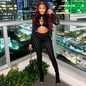 Perforated and hollowed out tight fitting round loop jumpsuit with exposed navel