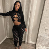 Perforated and hollowed out tight fitting round loop jumpsuit with exposed navel