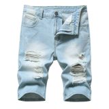 Perforated men's denim pants with many tattered jeans