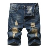 Perforated men's denim pants with many tattered jeans