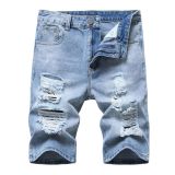 Perforated men's denim pants with many tattered jeans