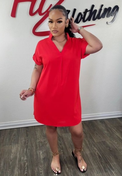 V-neck short sleeved medium length shirt with a flip collar and solid color dress