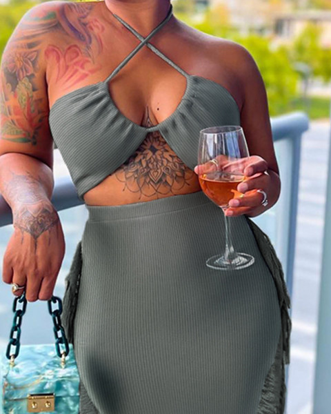 Sexy hanging neck with side fringe design for a tight fitting dress