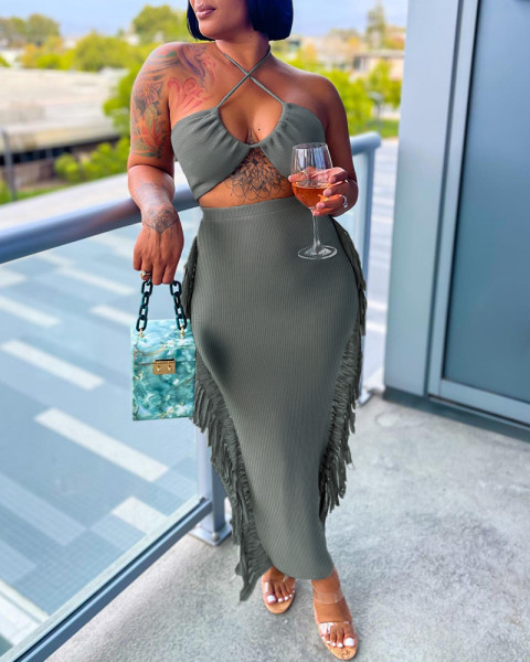 Sexy hanging neck with side fringe design for a tight fitting dress
