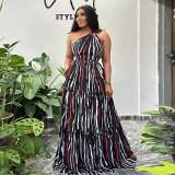 Printed patchwork with straps, large skirt hem, sloping shoulder, backless dress