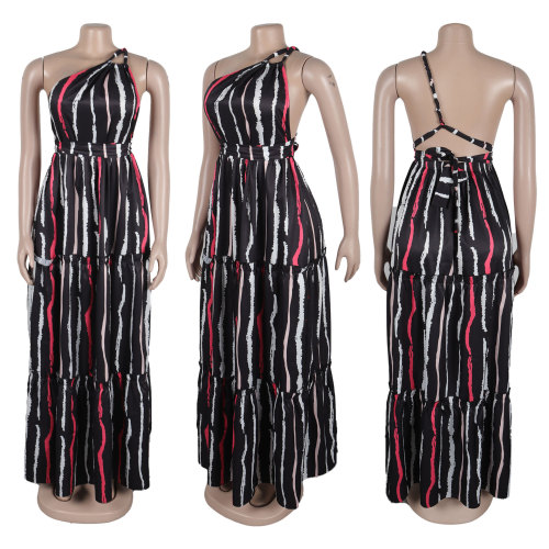 Printed patchwork with straps, large skirt hem, sloping shoulder, backless dress