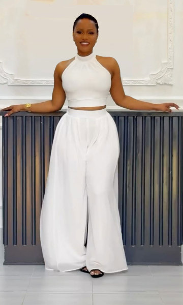 Two piece set of pleated sleeveless high waisted top and wide leg pants