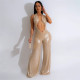 Open navel hanging neck and open back PU style wide leg jumpsuit