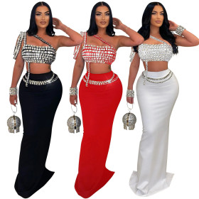Short suspender rhinestone top paired with slim fit hip hugging skirt