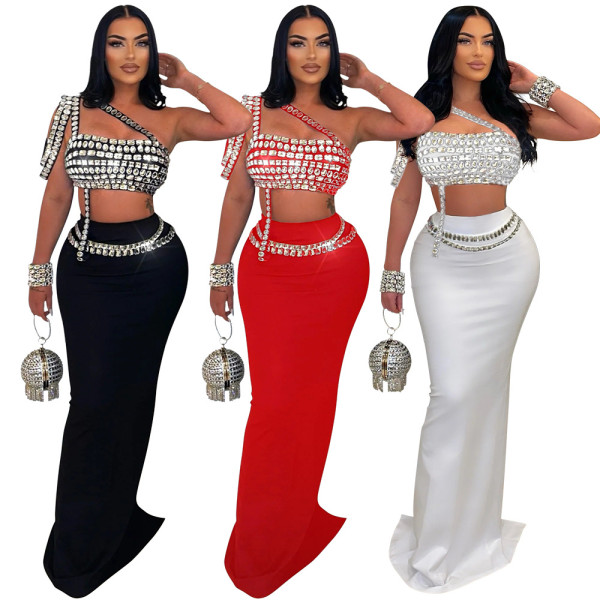 Short suspender rhinestone top paired with slim fit hip hugging skirt