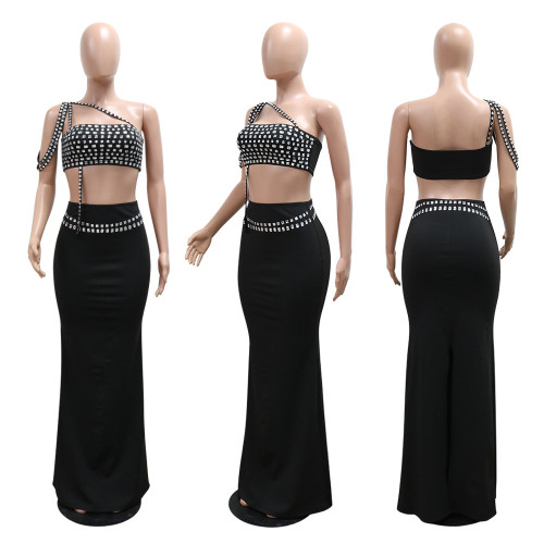 Short suspender rhinestone top paired with slim fit hip hugging skirt