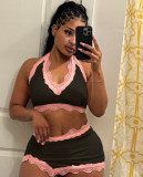 Two piece set of neck hanging V-neck vest and high waisted hip hugging half skirt