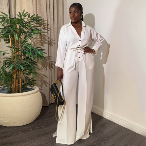 Solid color lapel long sleeved breasted waistband tie up wide leg jumpsuit