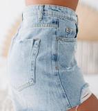 Washed denim shorts with holes and rough edges