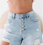 Washed denim shorts with holes and rough edges