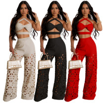 Strap top paired with hollowed out wide leg pants Strap top paired with hollowed out wide leg pants