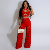 Strap top paired with hollowed out wide leg pants