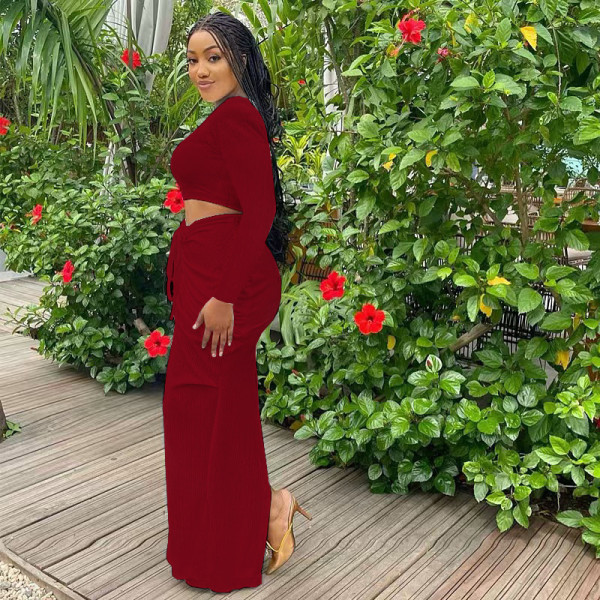 Women's long sleeved pleated waist revealing long skirt set