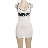 Low cut knitted vest, tight fitting jumpsuit, short skirt