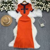 Color blocking round neck metal buckle knitted short sleeved dress