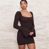 Bubble cloth hollow chest wrapped trumpet long sleeved dress