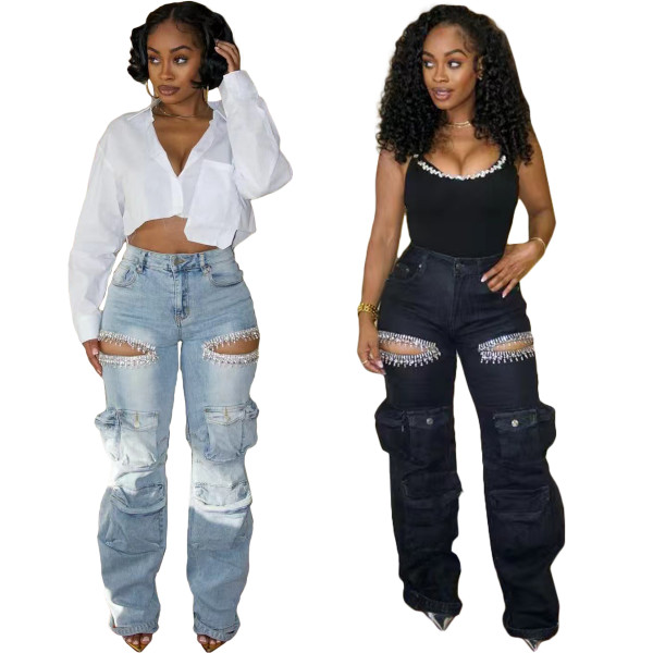 Washed denim jeans with multiple pockets and hand drilled openings