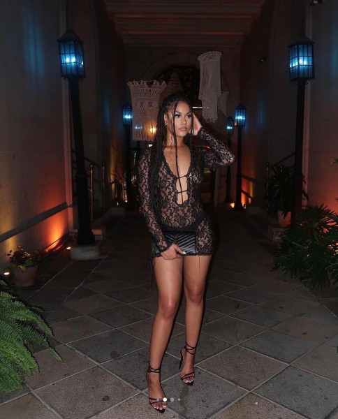 Solid color lace jumpsuit with low neckline and hollowed out long sleeved dress